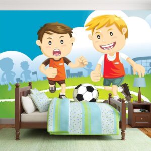 Fototapeta - Piłkarze - chłopcy grający w piłkę nożną na zielonym boisku dla dzieci